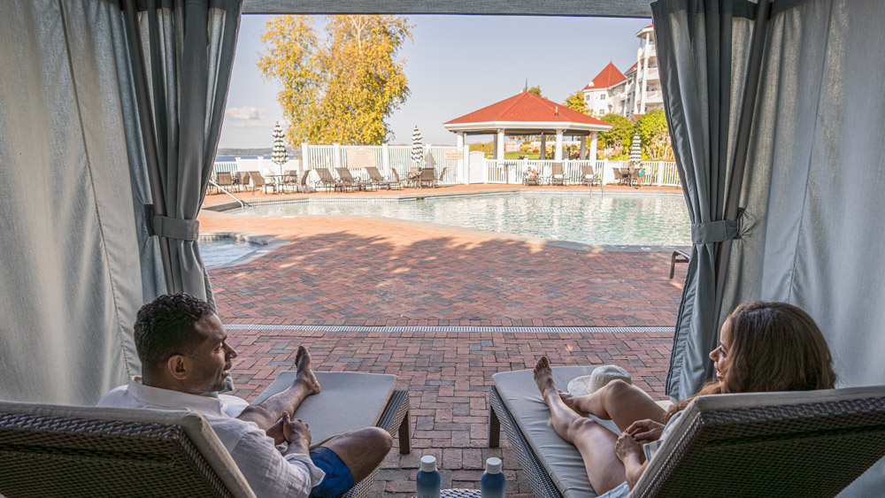 Couple enjoys Poolside Cabana, Inn at Bay Harbor